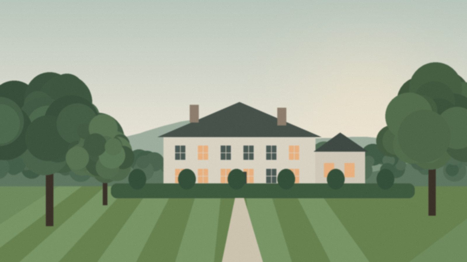 A pale stone country house behind clipped hedges and a striped lawn, framed by mature trees